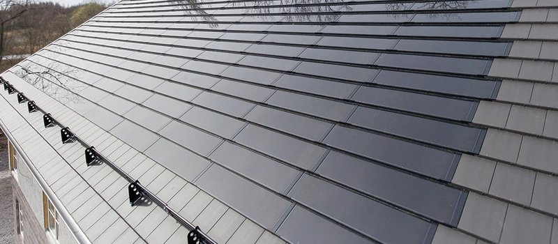 Renderings of a family house roof paved with solar tiles