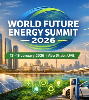 This is an official, technologically advanced visual promotional poster designed for the World Future Energy Summit (WFES) in Abu Dhabi 2026. At the top center is a giant blue globe icon, surrounded by a dynamic, deep green and bright green arc of ecological light, overlaid with the striking white bold lettering: ‘WORLD FUTURE ENERGY SUMMIT 2026’. Below this is a horizontal, deep green ribbon logo displaying the white dates and location of the event: ‘13–15 January 2026 | Abu Dhabi, UAE’. The mid-ground of the poster vividly showcases the cityscape of Abu Dhabi: on the left, towering modern glass-walled skyscrapers; in the center, the magnificent, classically styled white Sheikh Zayed Grand Mosque dome; and in the foreground, a clear, turquoise river. The foreground showcases the green energy ecosystem: in the lower left corner, a row of neatly arranged, sun-facing, deep blue solar photovoltaic panels; in the lower right corner, a white electric car is being charged by a silver smart charging station; and in the distance, a cluster of rotating wind turbines stands on a hillside. At the bottom of the image, in the center of a lawn, five green hexagonal icons representing new energy technologies (including wind power, a water droplet, recycling, an eco-symbol, and an energy-saving light bulb) are arranged vertically. The entire image is rich in color, perfectly blending technology, humanity, nature, and future energy.